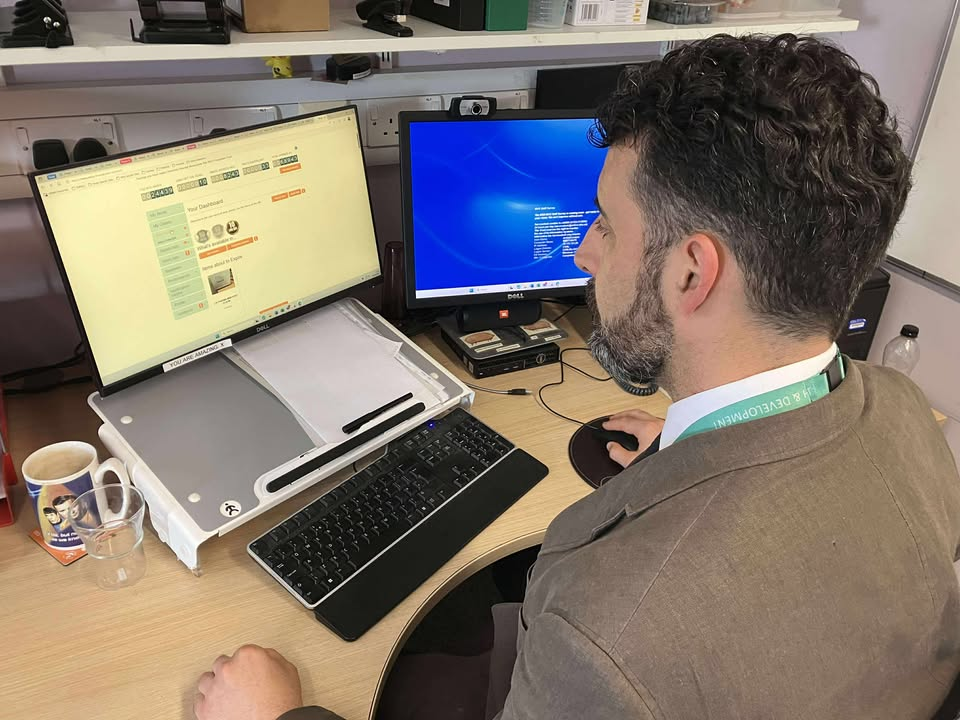 Andrew Poppa sits at a computer