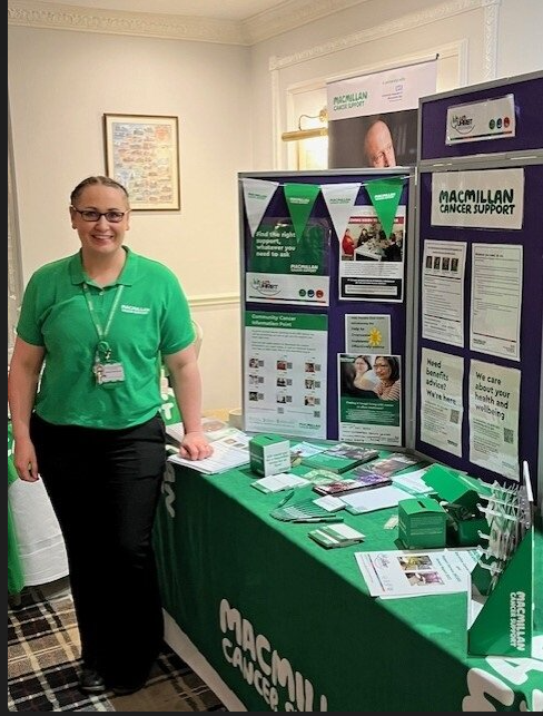 Macmillan Cancer Information and Support Service Team stand at the Cancer health and wellbeing event.png